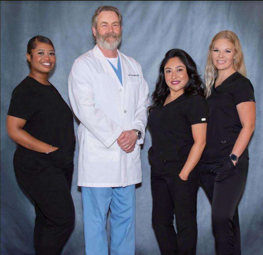 Group photo of Office Staff and Dr. Mark